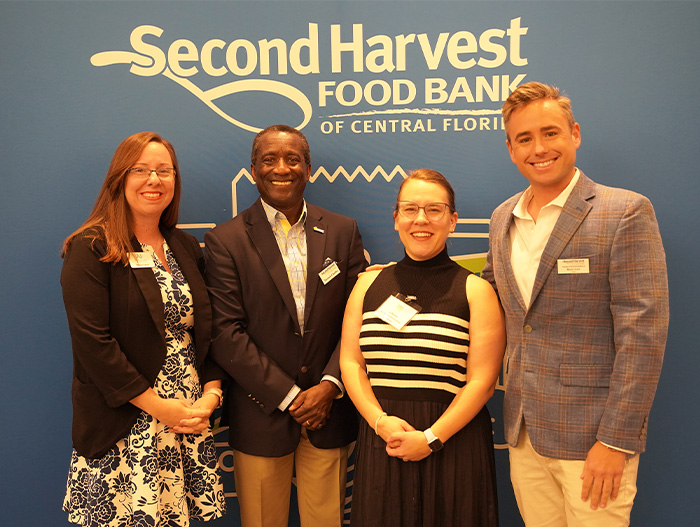 Ryan Grail with CEO and other volunteers