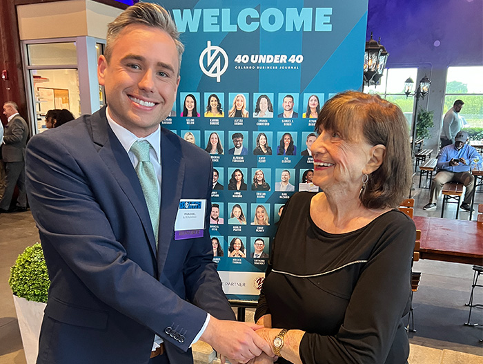 Ryan Grail at 40 Under 40 getting handshake