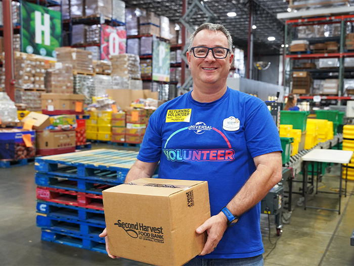 Volunteers from Universal in warehouse