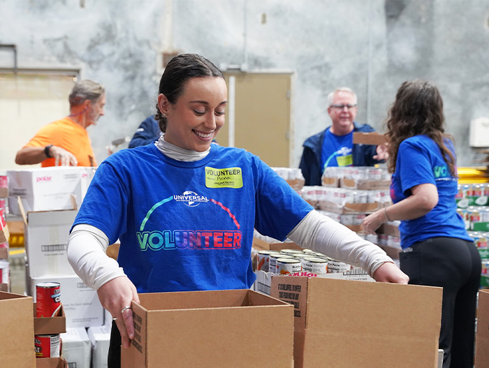 Volunteers from Universal in warehouse