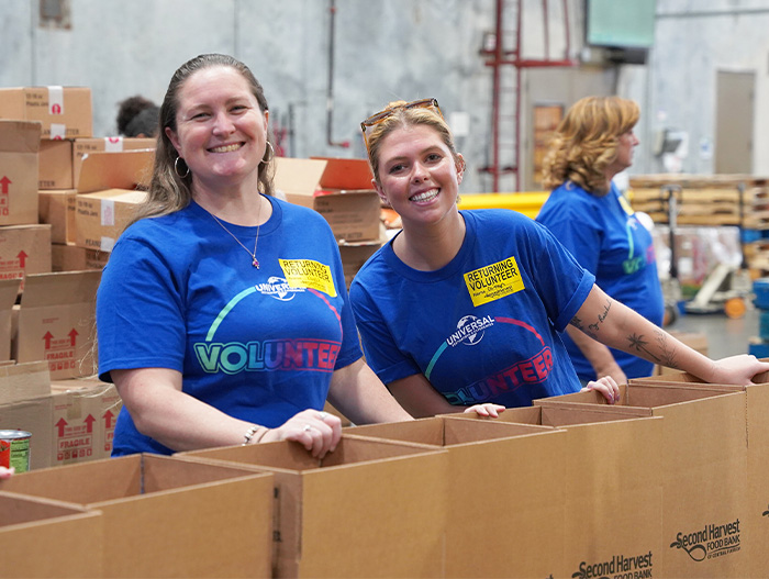 Volunteers from Universal in warehouse