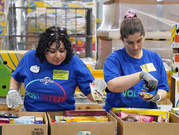 Volunteers from Universal in warehouse