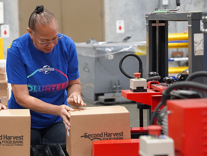 Volunteers from Universal in warehouse