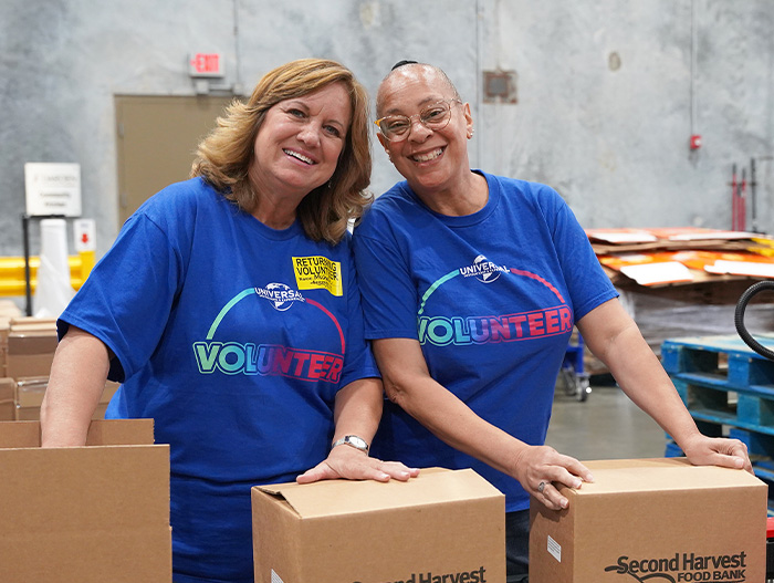 Volunteers from Universal in warehouse