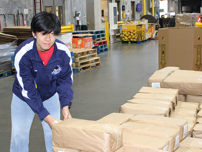 Volunteer sorting donations