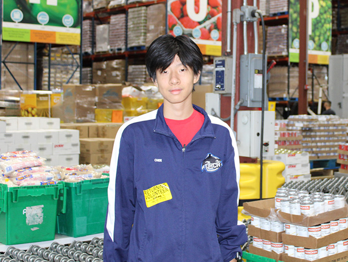 Volunteer sorting donations