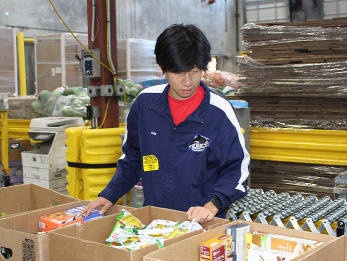 Volunteer sorting donations