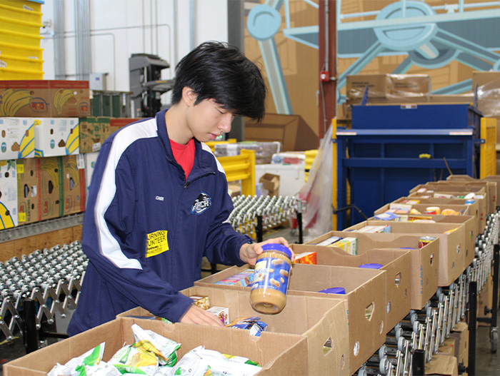 Volunteer sorting donations